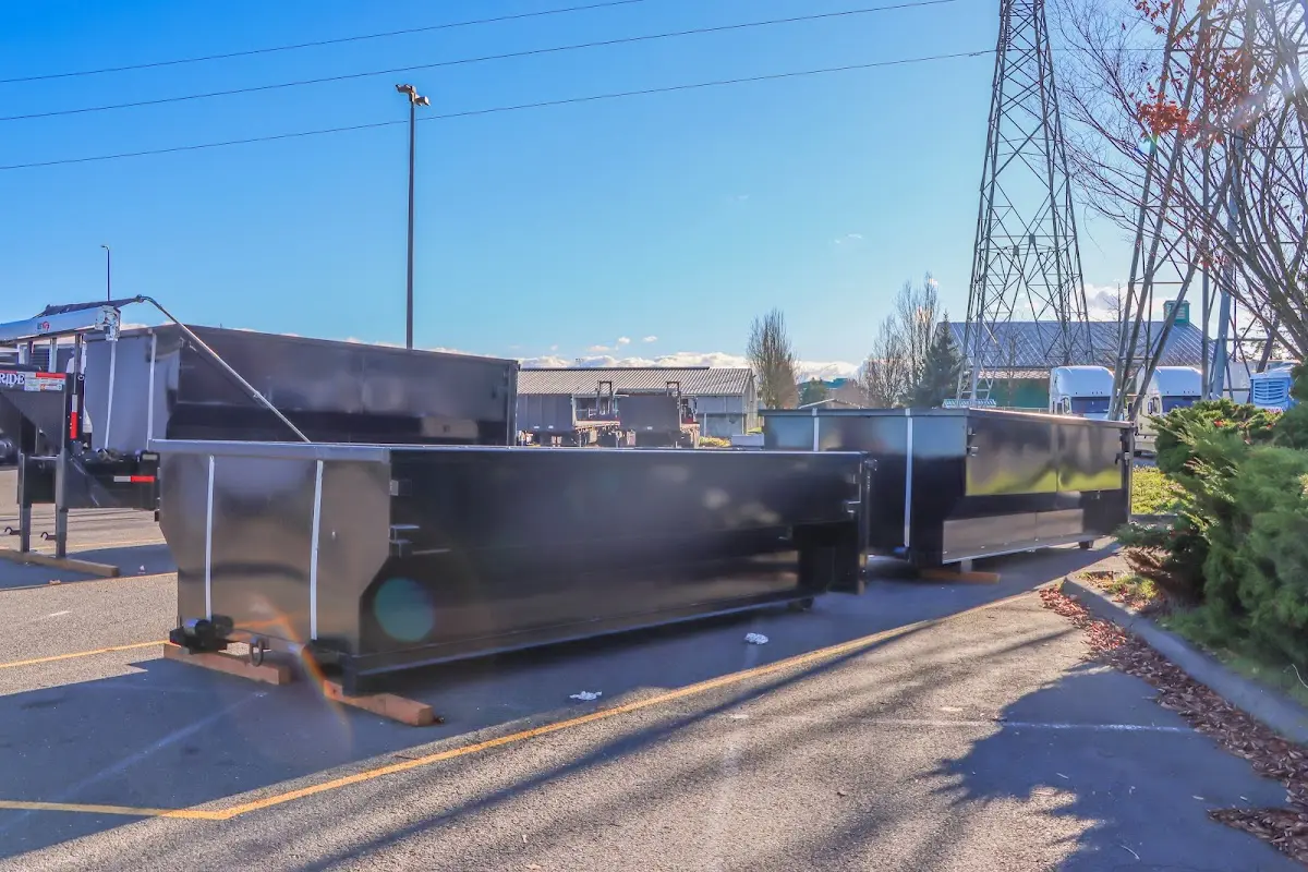 Roll-off dumpster ready for waste disposal at job site for Construction Dumpster Rental in Oelwein